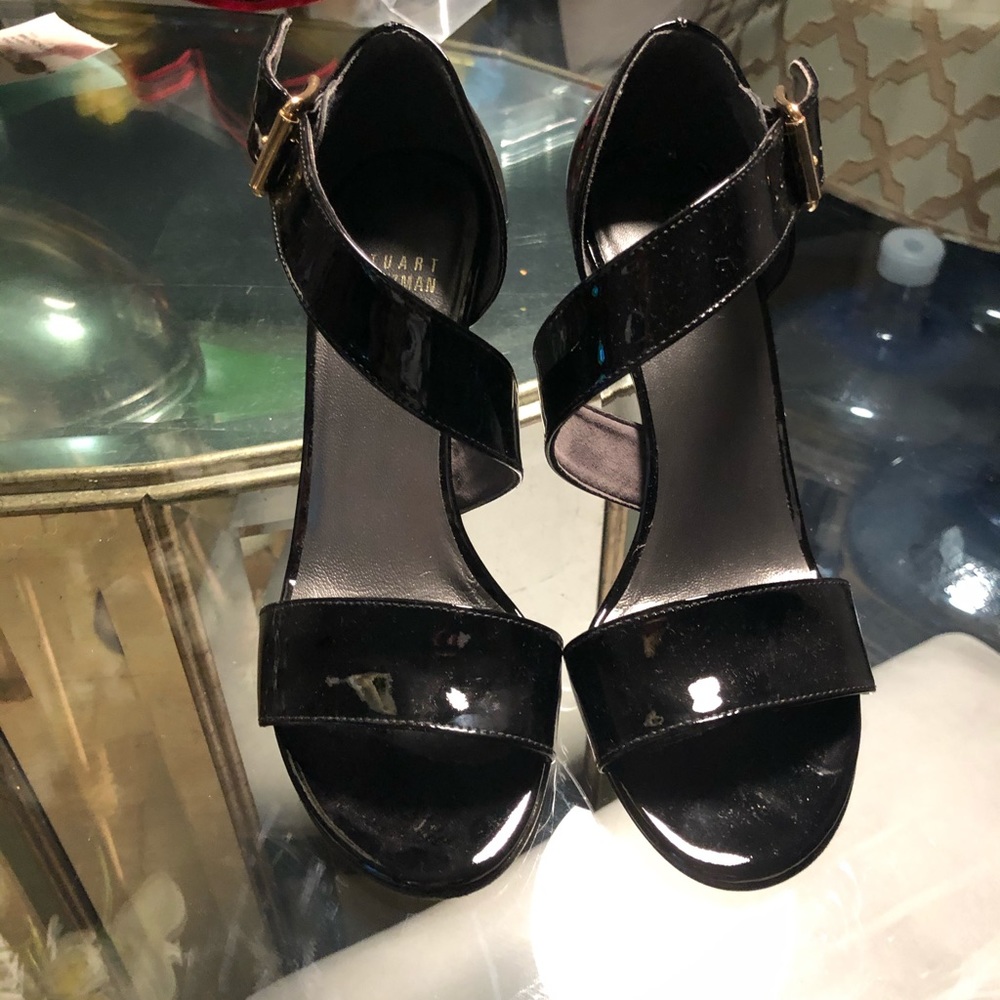 Size 6 Stuart Weitzman open toed wedged heel.